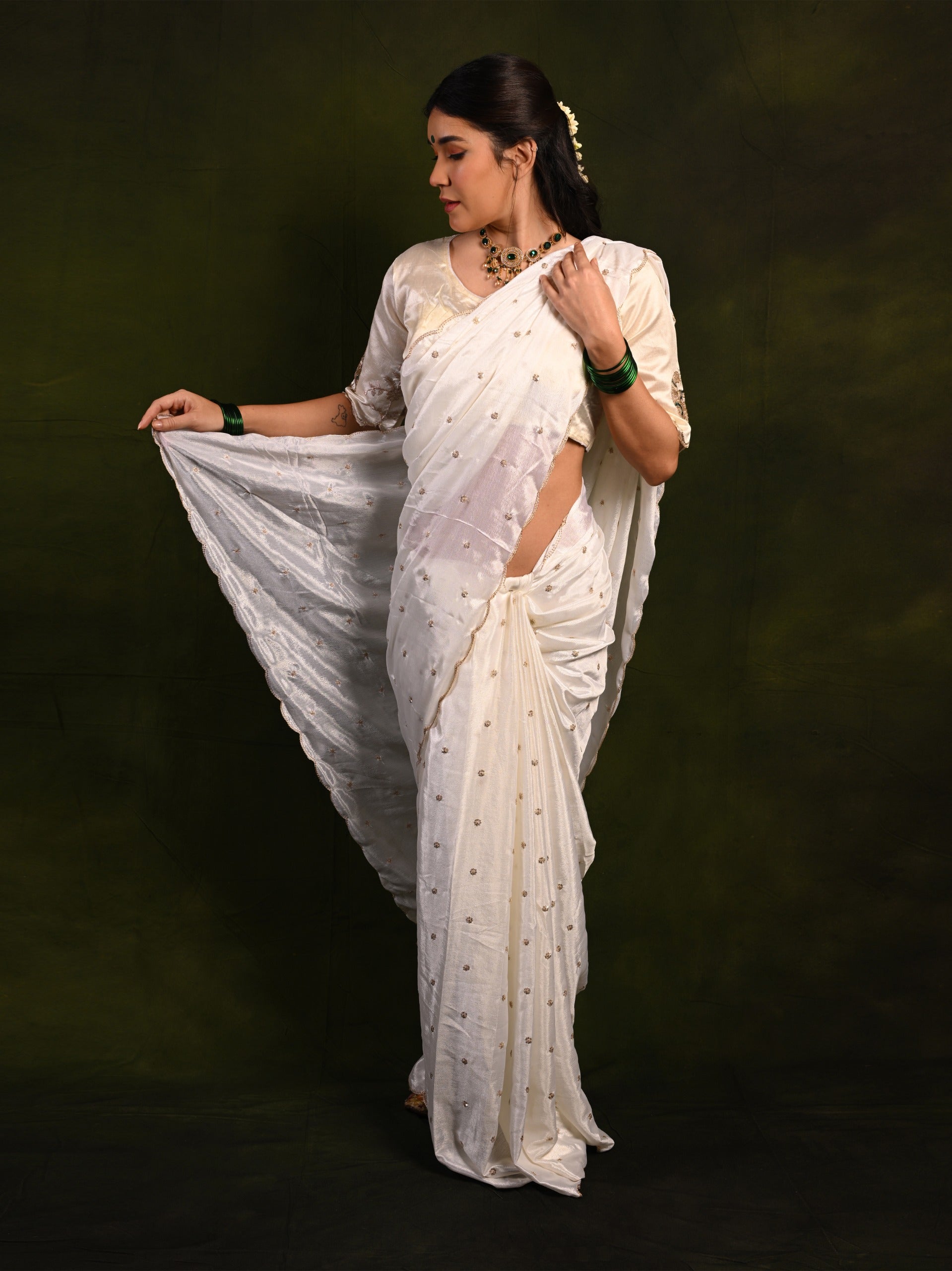 Elegant Chinon saree with sequence work, draping gracefully for a sophisticated look at festive events